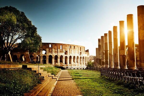 Italian amphitheater with the sun hidden behind the columns