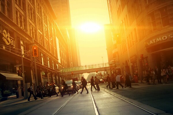 People cross the road in the city of Toronto