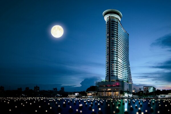 Bangkok city at night under the moon