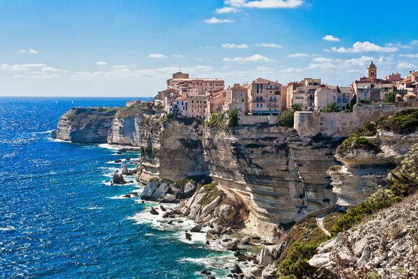 Houses on the edge of the cliffs by the sea