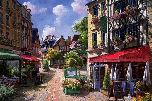 A picture of a nice street with houses and cafes