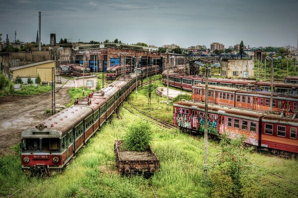 Abandoned buildings. Old train compositions