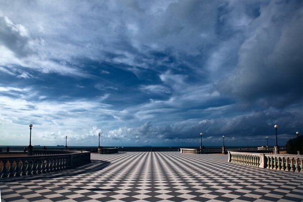 The city of Tuscany in Italy is remembered for its beautiful terraces with lanterns and blue sky