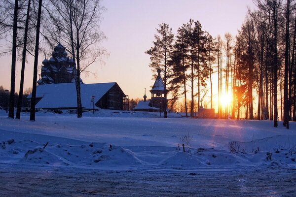 Temple at sunset in the winter forest