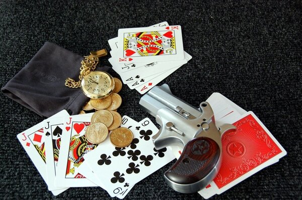 Cards, weapons, coins on the table