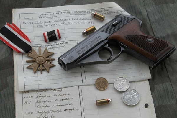 Self-loading German minigun on a document with cartridges and coins