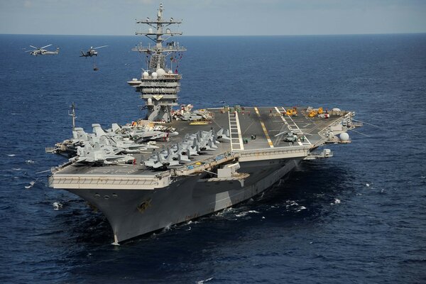 Aircraft carrier with combat fighters on board