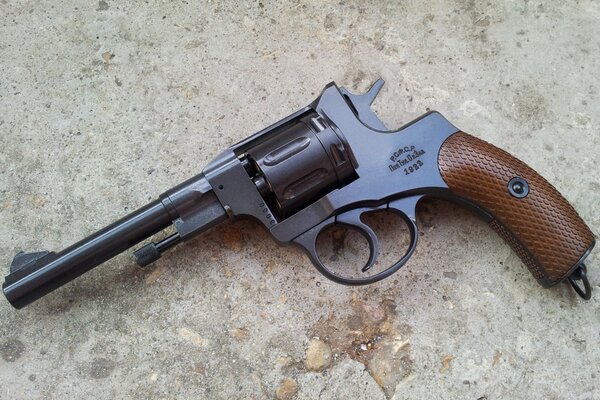 Firearms, a revolver on a stone slab