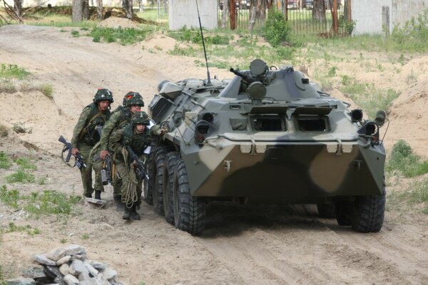 Armored personnel carrier at military exercises at the tactical training ground