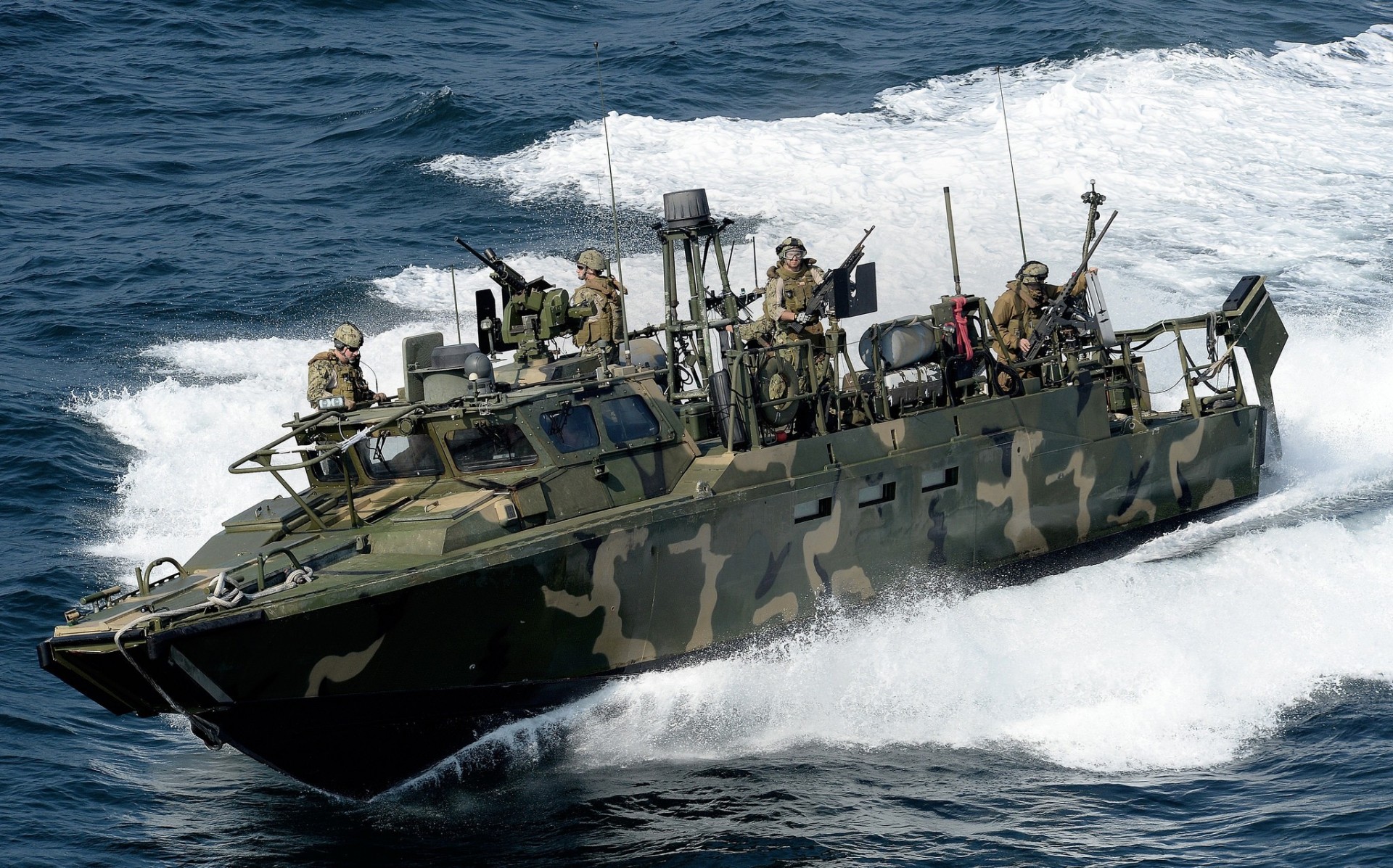 men wave sea dry needle team boat