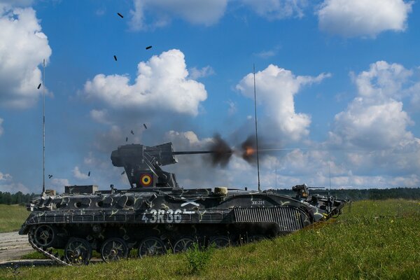 Armored vehicles in action. Shooting is going on