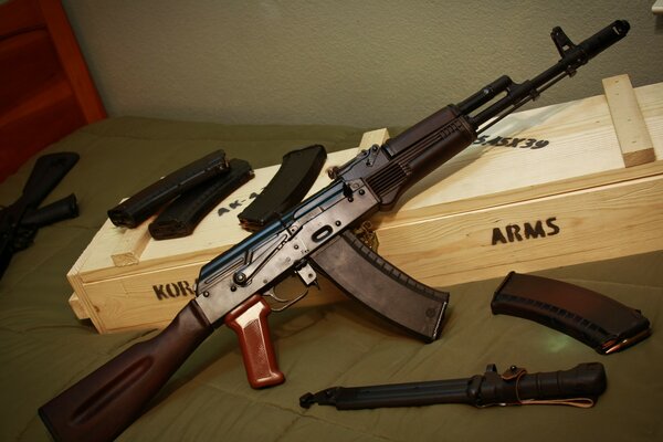 The Kalashnikov assault rifle is lying on the box