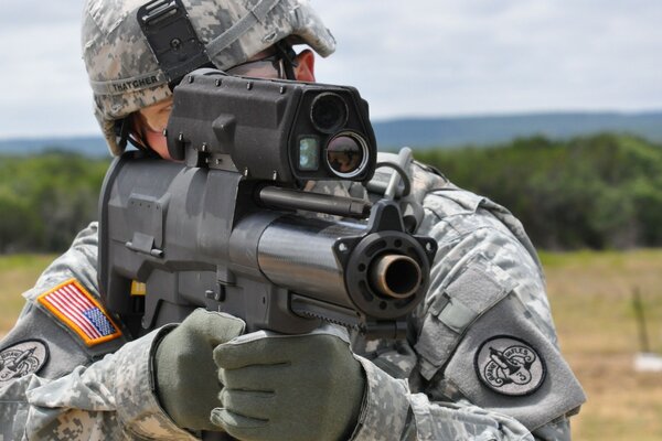 A US soldier takes aim before firing