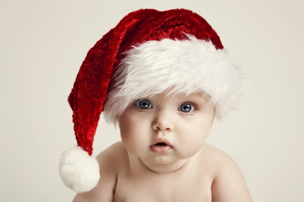 Adorable baby in a Christmas hat