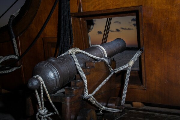 Gun mounted on the ship photo at night