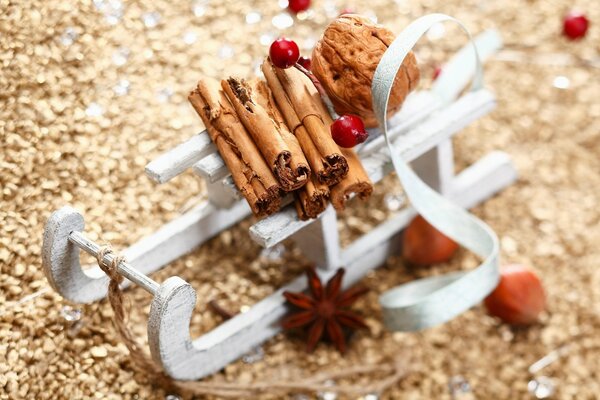 Cinnamon sticks on a white sled