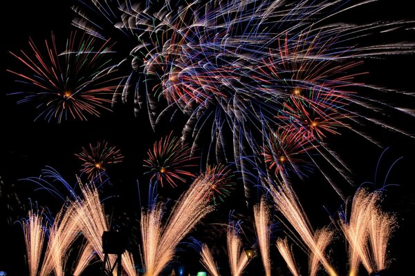 Colored fireworks on the background of the night sky