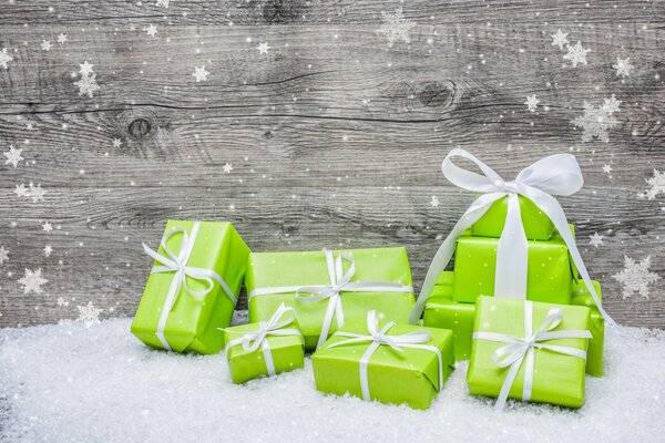 Green gifts on a tree background