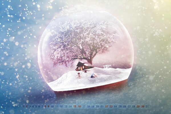 Calendar snow globe with a tree