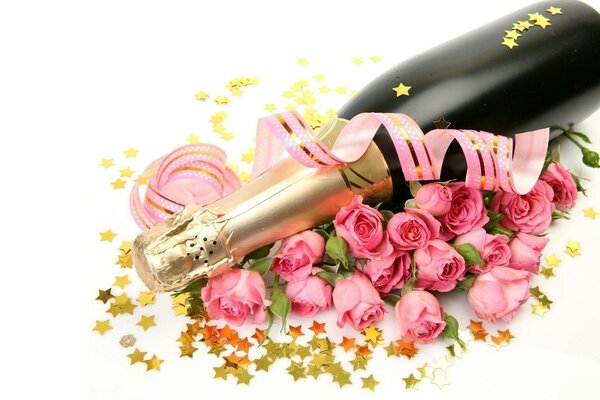 Una botella de champán y un ramo de rosas para cualquier celebración