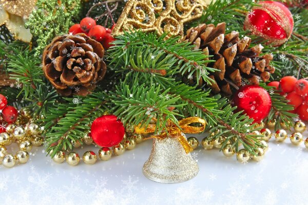 Christmas garland with cones, bell and toys