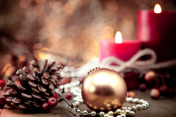 Christmas atmosphere. Ball, bump and red candles