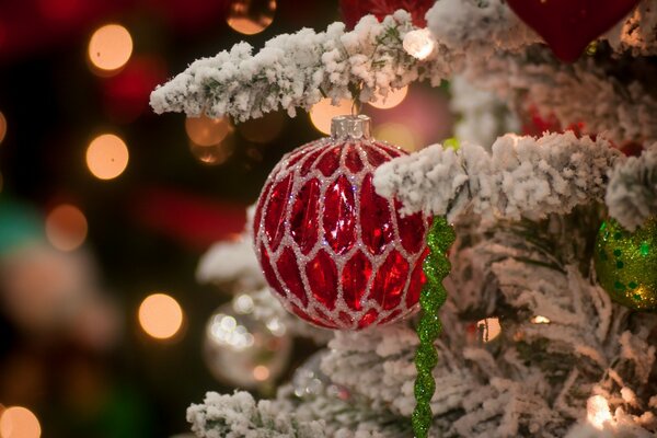 White Christmas tree with a red toy