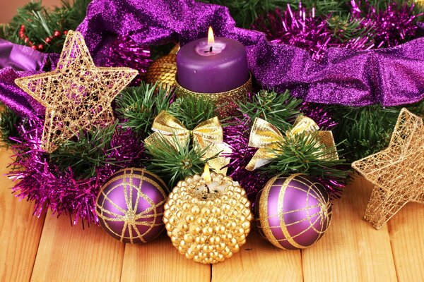 Christmas decorations in purple style candles stars balls