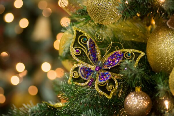 Foto de año nuevo de juguete de mariposa con efecto bokeh