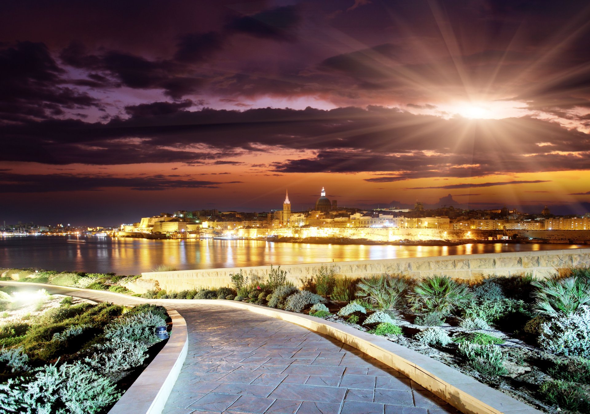 evening city clouds beauty season landscape road evening sunset sun city path buildings horizon