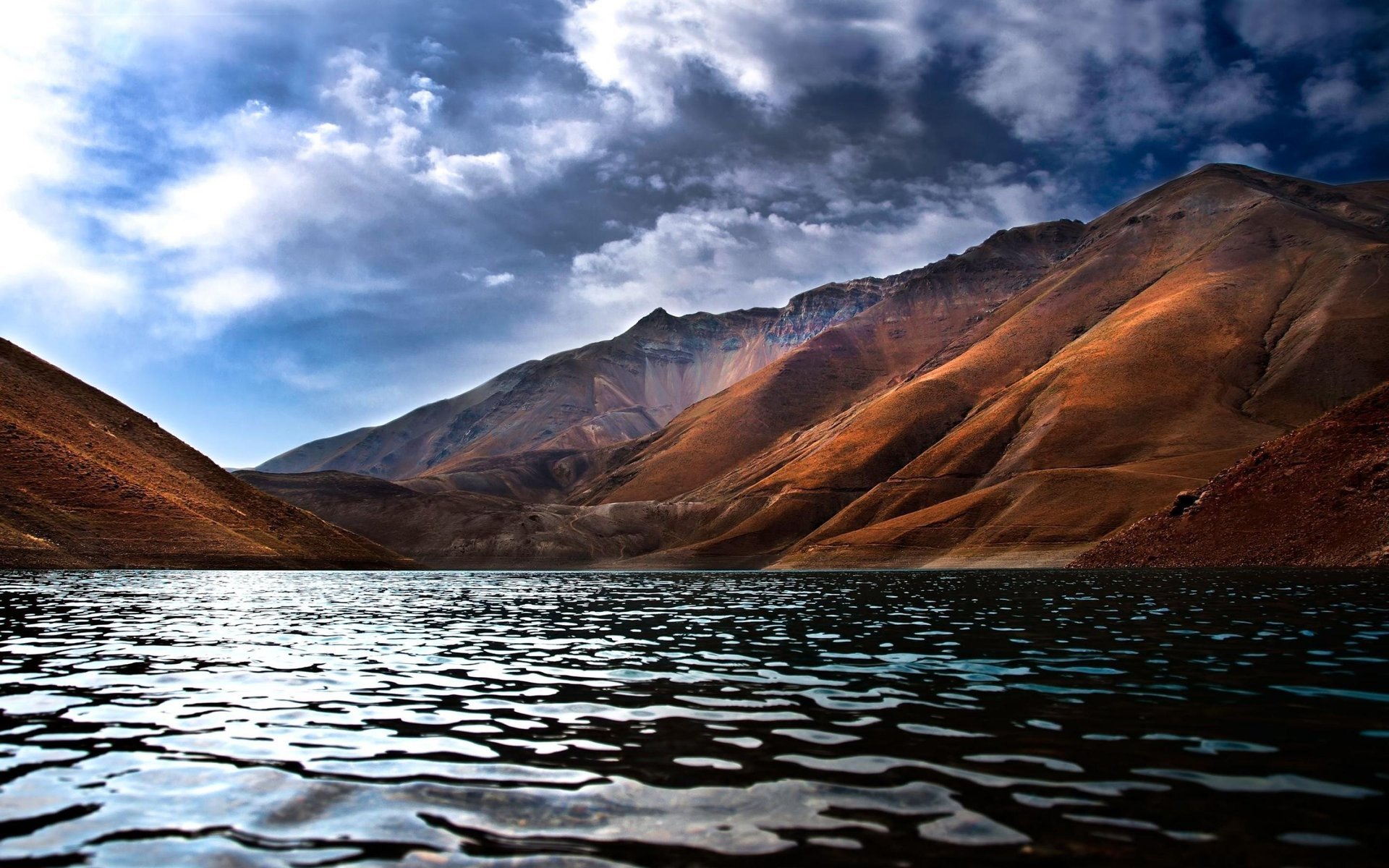 lake rocks water the sky mountain