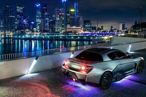 Tuned mazda rx-8 with neon lights in the city