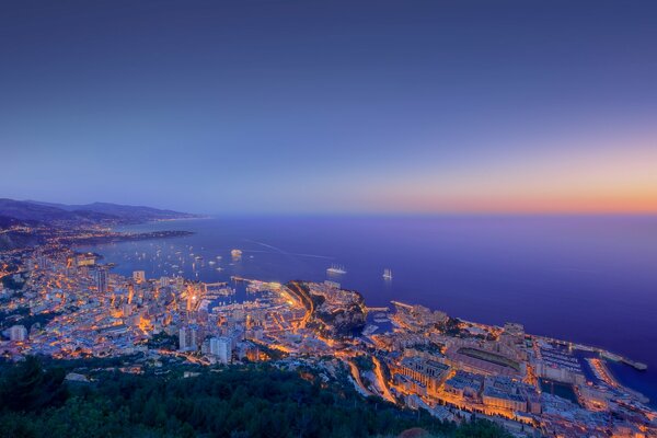 Sunset on the background of the city coast