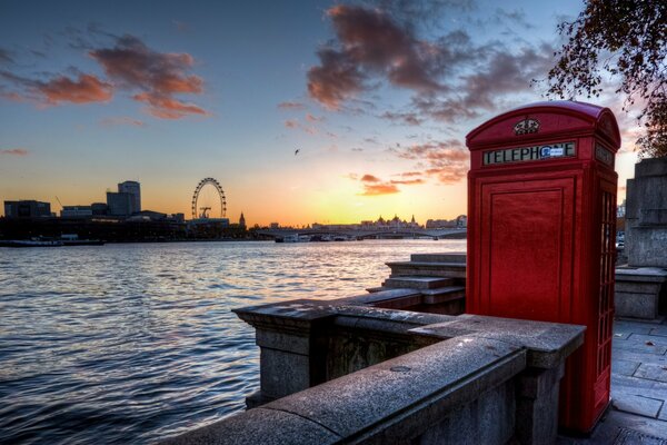 Telephone booth in London at sunset