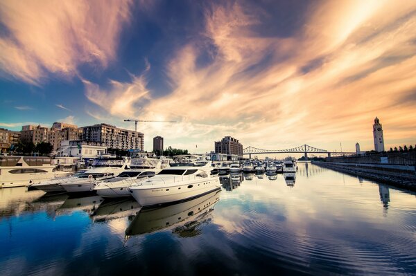 Yachts and boats in the clouds of the river sky