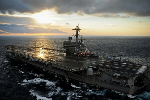 Aircraft carrier crash at sunset