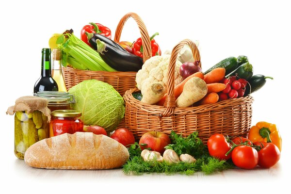 Baskets with vegetables and a bottle of wine