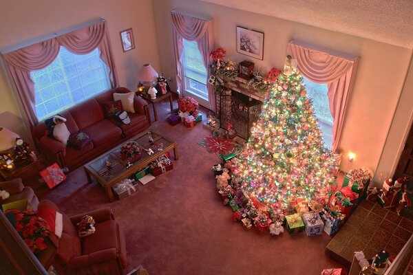 A smartly decorated fir tree with New Year s gifts under it