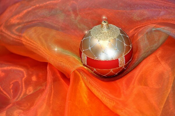 Boule de Noël sur tissu orange