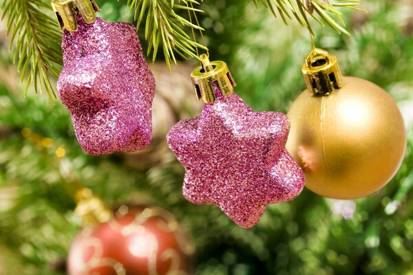 Pink stars and red balls on the Christmas tree