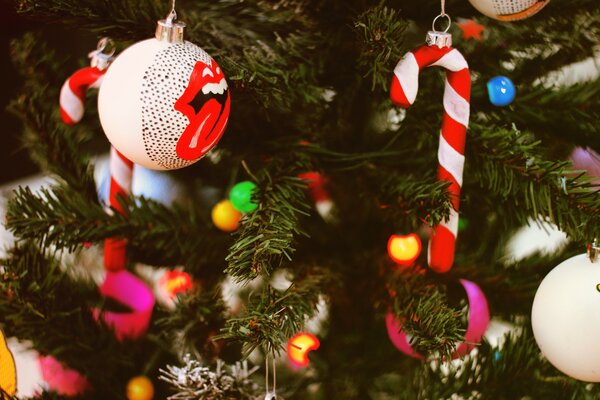 Christmas toys and retro candy hanging on the Christmas tree