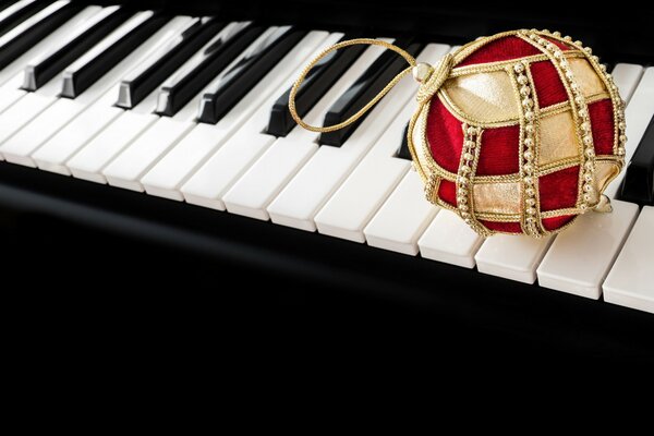 Christmas ball lying on the keys