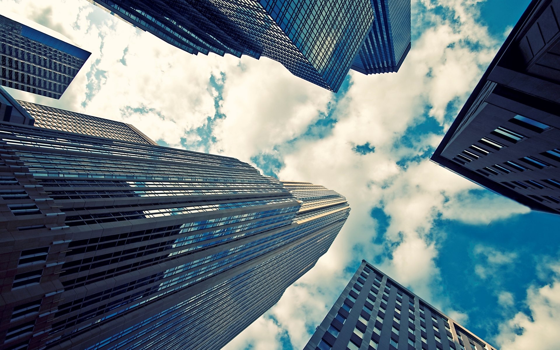 city skyscrapers buildings glass reflection sky clouds angle photo background wallpaper picture