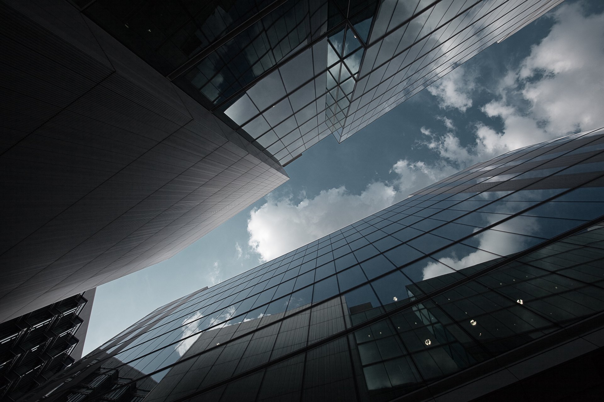 city skyscrapers buildings glass reflection sky clouds photo angle background wallpaper