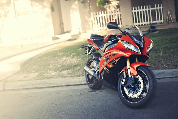 Red motorcycle at the house