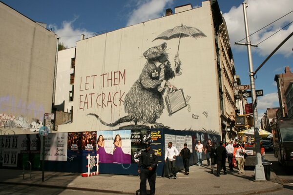 Graffiti an der Fassade des Gebäudes mit dem Bild einer Ratte