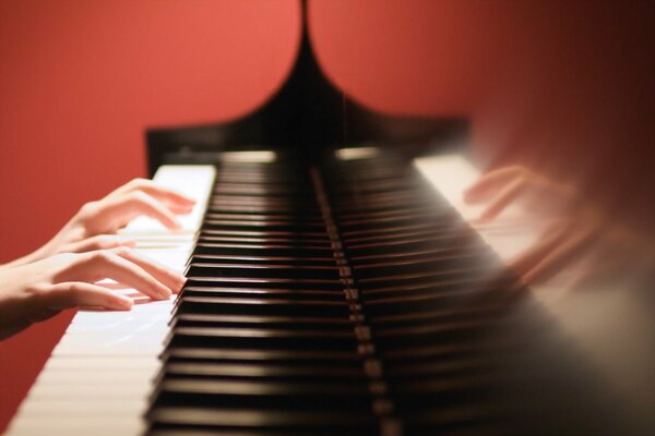 Playing the piano with two hands