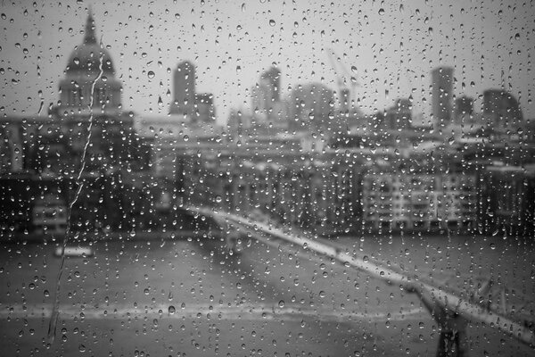 Drops on the glass. Window on the river