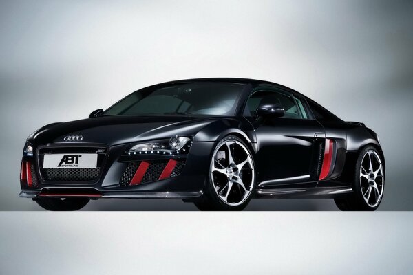 Black audi r8 car with red stripes