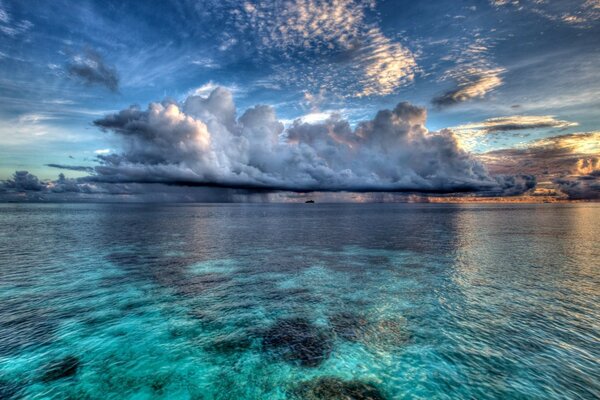 Clear cloud on blue water